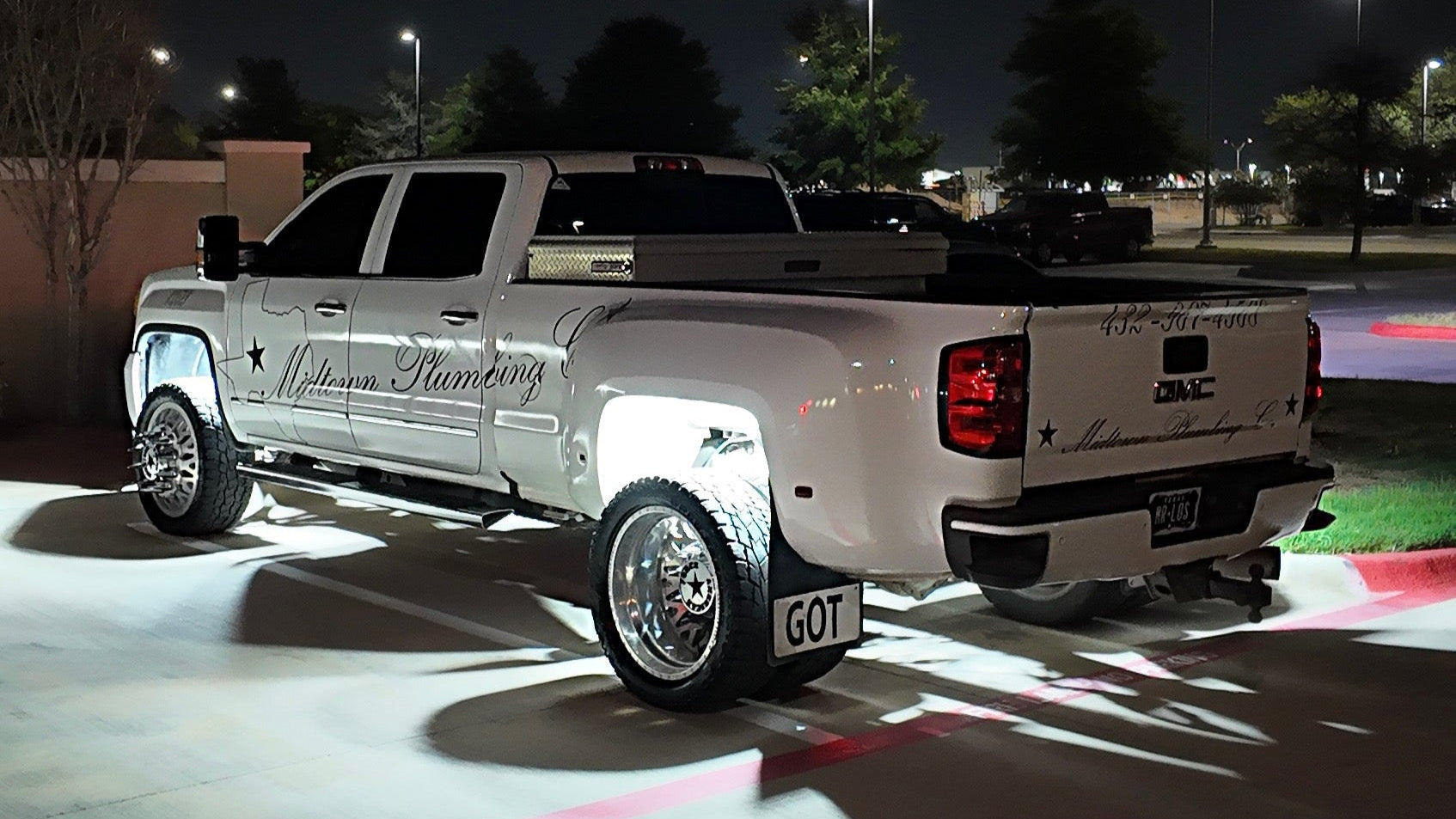 White Dually truck with rocklights